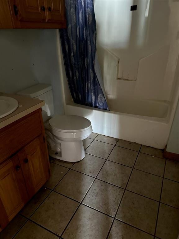 full bath featuring shower / tub combo with curtain, toilet, tile patterned floors, and vanity