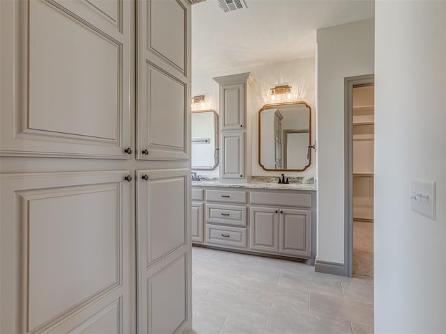 1209 Jozie Way, Tuttle, OK 73089 - full bathroom with double vanity, visible vents, tile patterned flooring, a sink, and a closet