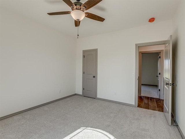 1209 Jozie Way, Tuttle, OK 73089 - unfurnished bedroom featuring carpet flooring, baseboards, and ceiling fan