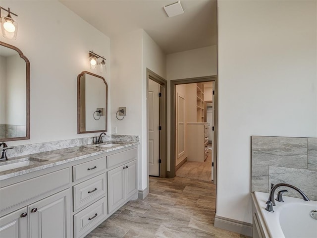 1212 Jaden Blvd, Tuttle, OK 73089 - full bath featuring double vanity, a garden tub, and a walk in closet