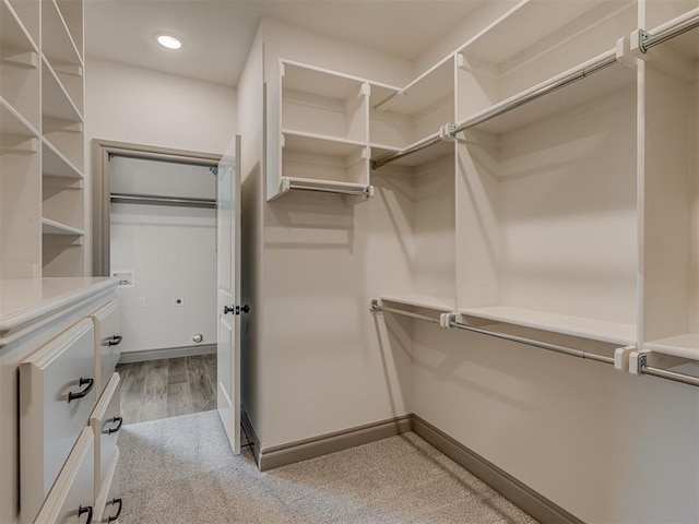 1212 Jaden Blvd, Tuttle, OK 73089 - walk in closet featuring light wood-style flooring