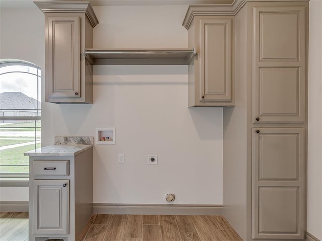 1212 Jaden Blvd, Tuttle, OK 73089 - washroom featuring hookup for a washing machine, hookup for an electric dryer, light wood-style flooring, and baseboards