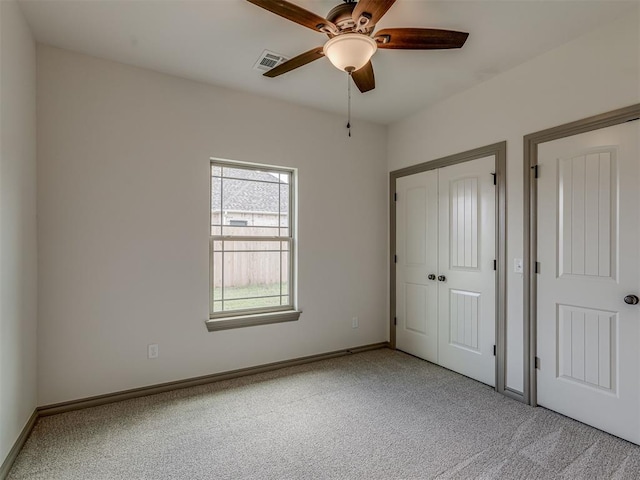 1212 Jaden Blvd, Tuttle, OK 73089 - unfurnished bedroom with carpet floors, baseboards, and ceiling fan