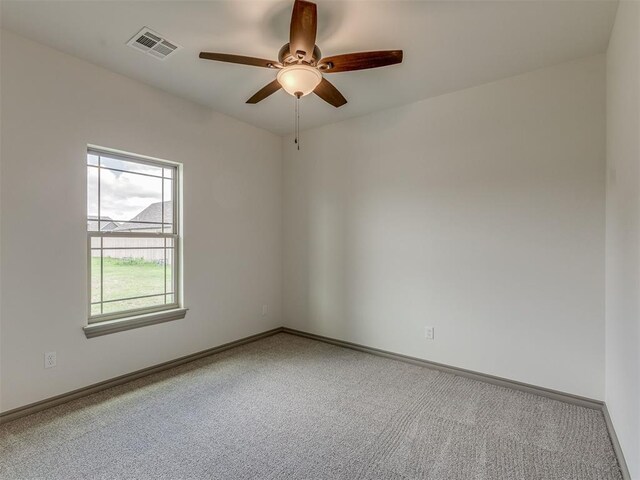 1212 Jaden Blvd, Tuttle, OK 73089 - unfurnished room featuring ceiling fan, carpet floors, and baseboards