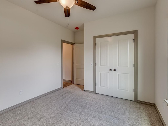 1212 Jaden Blvd, Tuttle, OK 73089 - unfurnished bedroom with light colored carpet, a closet, baseboards, and ceiling fan