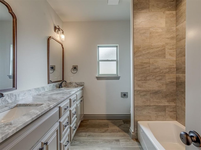 1212 Jaden Blvd, Tuttle, OK 73089 - bathroom with double vanity, baseboards, and toilet