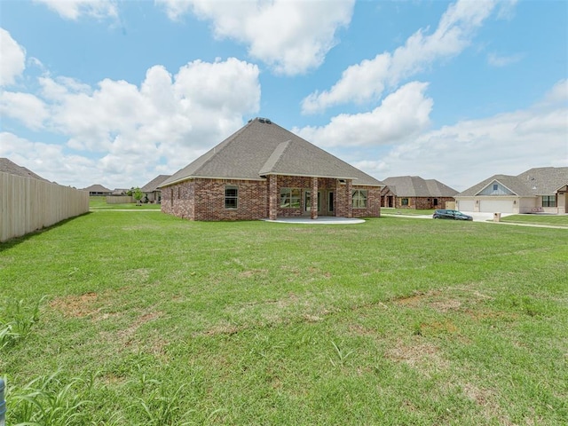 1212 Jaden Blvd, Tuttle, OK 73089 - back of house with brick siding and a patio