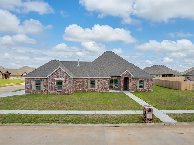 1212 Jaden Blvd, Tuttle, OK 73089 - view of front of property featuring roof with shingles, brick siding, and stone siding