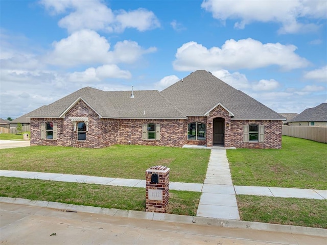 1212 Jaden Blvd, Tuttle, OK 73089 - french country inspired facade with roof with shingles and brick siding