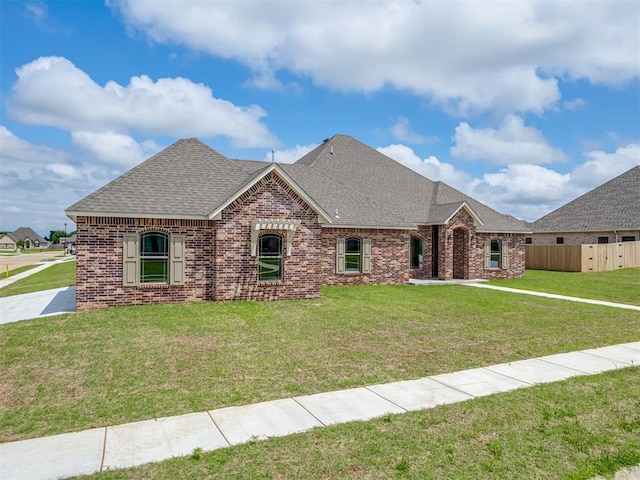 1212 Jaden Blvd, Tuttle, OK 73089 - view of front of home featuring roof with shingles and brick siding