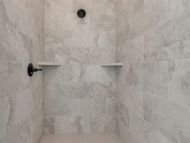 details with a tile shower