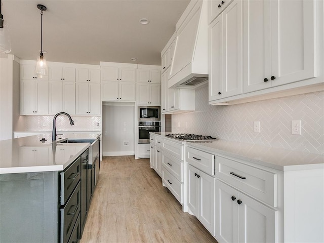 4253 Hawthorne St, Piedmont, OK 73078 - kitchen featuring stainless steel appliances, a sink, white cabinets, and light countertops