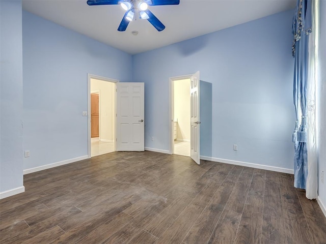 13216 SW 10th St, Yukon, OK 73099 - unfurnished bedroom featuring dark wood finished floors, baseboards, ensuite bath, and ceiling fan