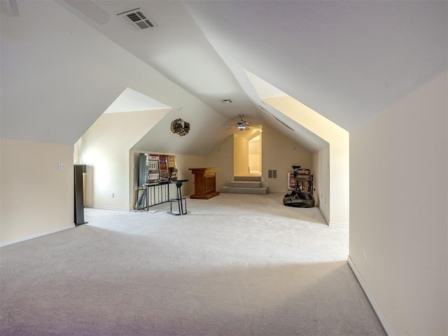 13216 SW 10th St, Yukon, OK 73099 - bonus room featuring vaulted ceiling, light colored carpet, a ceiling fan, and baseboards