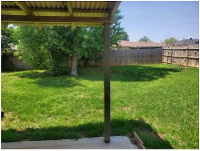 1313 Kingston Dr, Yukon, OK 73099 - view of yard featuring a fenced backyard