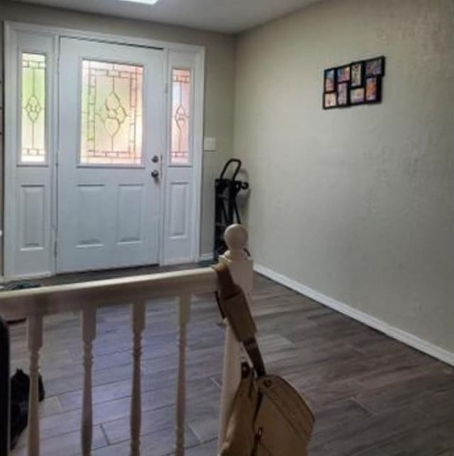 1313 Kingston Dr, Yukon, OK 73099 - foyer featuring wood finished floors, baseboards, and plenty of natural light