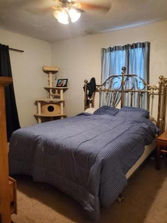 1313 Kingston Dr, Yukon, OK 73099 - bedroom featuring a ceiling fan and carpet floors