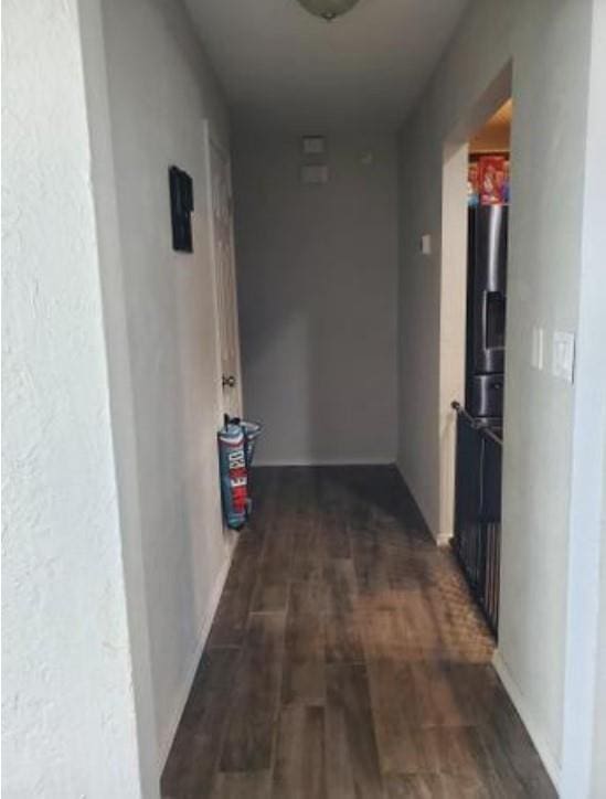 1313 Kingston Dr, Yukon, OK 73099 - hallway featuring dark wood-style flooring