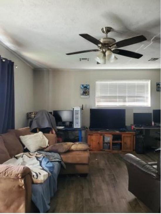 1313 Kingston Dr, Yukon, OK 73099 - living area featuring visible vents, a ceiling fan, and wood finished floors