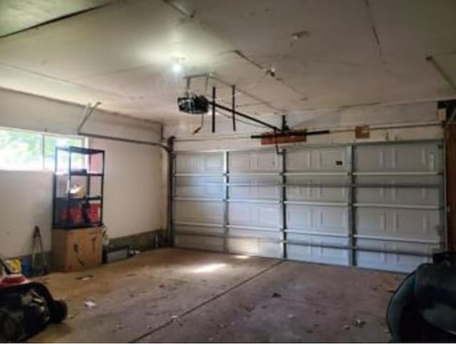 1313 Kingston Dr, Yukon, OK 73099 - garage featuring a garage door opener