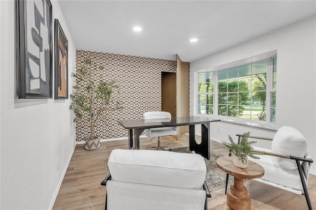 636 E Lea Ter, Mustang, OK 73064 - sitting room featuring an accent wall, baseboards, recessed lighting, wallpapered walls, and light wood-style floors