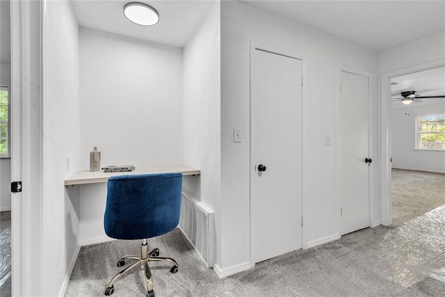 636 E Lea Ter, Mustang, OK 73064 - unfurnished office with carpet floors, built in desk, baseboards, and a ceiling fan