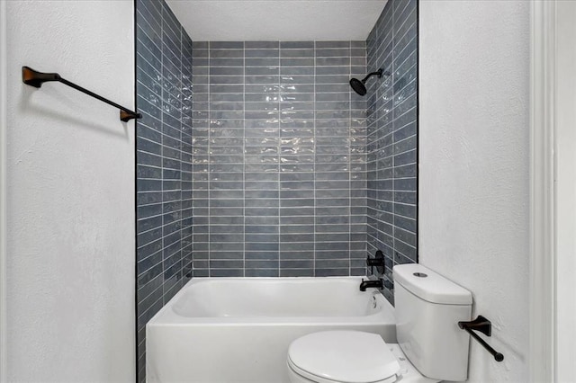 636 E Lea Ter, Mustang, OK 73064 - full bath featuring toilet, tub / shower combination, and a textured wall
