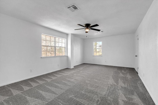 636 E Lea Ter, Mustang, OK 73064 - carpeted spare room with ceiling fan, a textured ceiling, and baseboards