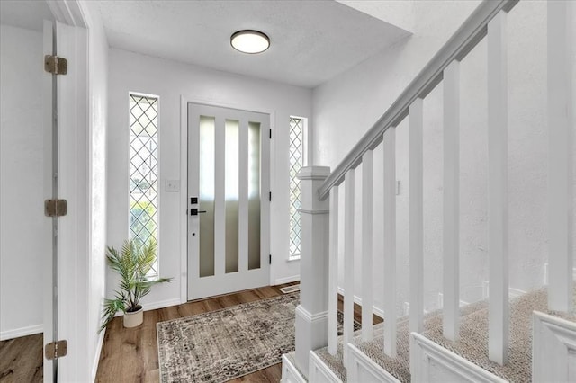 636 E Lea Ter, Mustang, OK 73064 - foyer with plenty of natural light, wood finished floors, and stairs