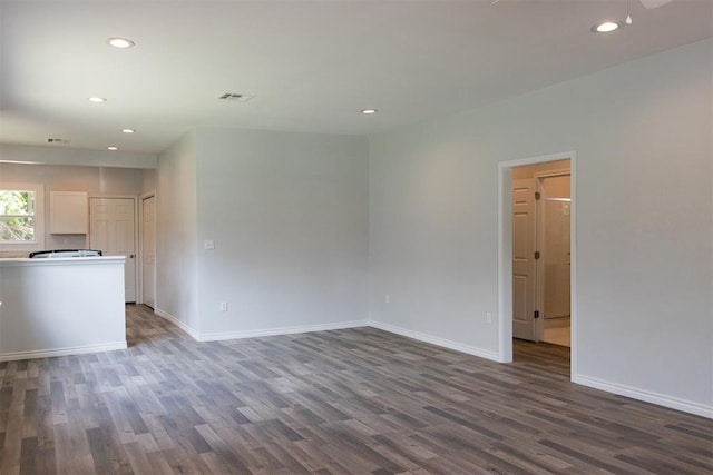 unfurnished living room featuring recessed lighting, visible vents, baseboards, and wood finished floors