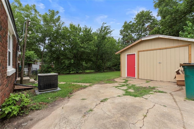 view of patio featuring central AC unit and an outdoor structure