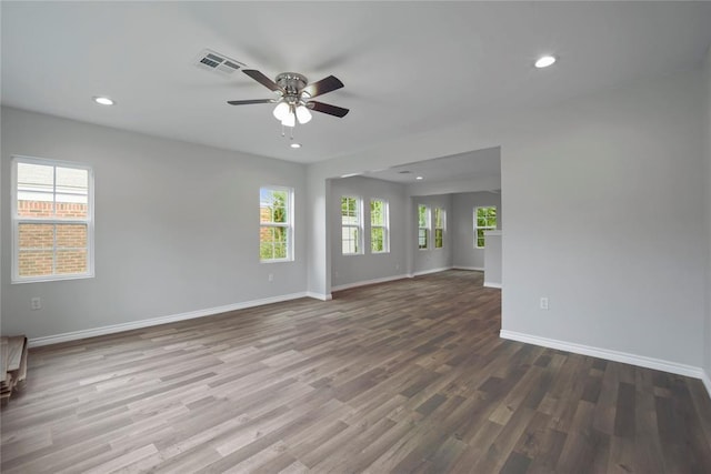 unfurnished room featuring visible vents, baseboards, ceiling fan, recessed lighting, and wood finished floors