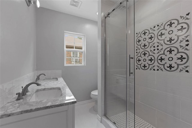full bathroom with a shower stall, visible vents, and a sink