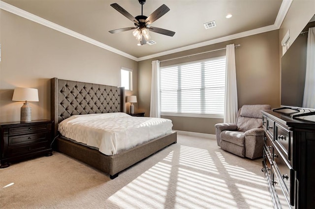 bedroom with baseboards, light carpet, crown molding, a ceiling fan, and visible vents