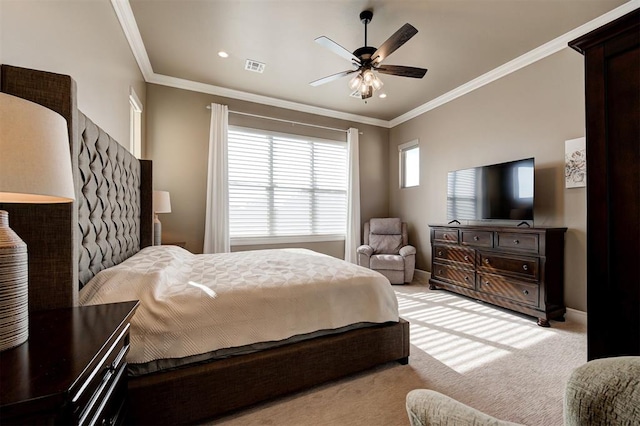 bedroom with light carpet, visible vents, baseboards, and crown molding