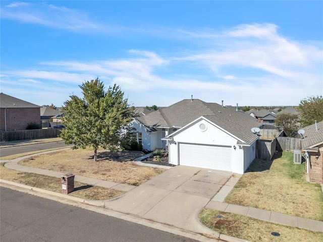 11245 NW 101st St, Yukon, OK 73099 - ranch-style home with a garage, concrete driveway, a residential view, and stucco siding