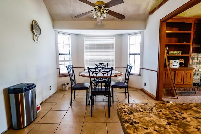 dining room featuring light tile patterned floors and a ceiling fan