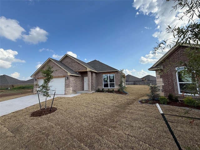 1124 SW 139th St, Oklahoma City, OK 73170 - view of front of house with concrete driveway, brick siding, and an attached garage
