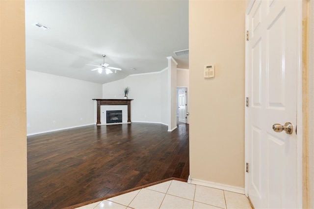 5309 SE 78th St, Oklahoma City, OK 73135 - unfurnished living room featuring a ceiling fan, wood finished floors, baseboards, and a glass covered fireplace