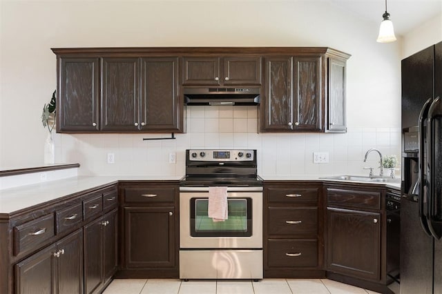 5309 SE 78th St, Oklahoma City, OK 73135 - kitchen with under cabinet range hood, stainless steel electric range, a sink, black fridge, and dark brown cabinets