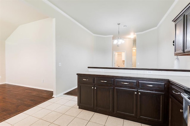 5309 SE 78th St, Oklahoma City, OK 73135 - kitchen featuring a peninsula, dark brown cabinets, crown molding, a chandelier, and baseboards