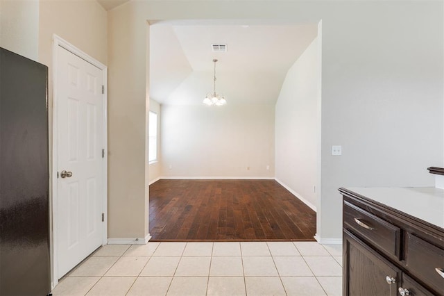 5309 SE 78th St, Oklahoma City, OK 73135 - unfurnished dining area featuring a chandelier, lofted ceiling, baseboards, and light wood-style floors