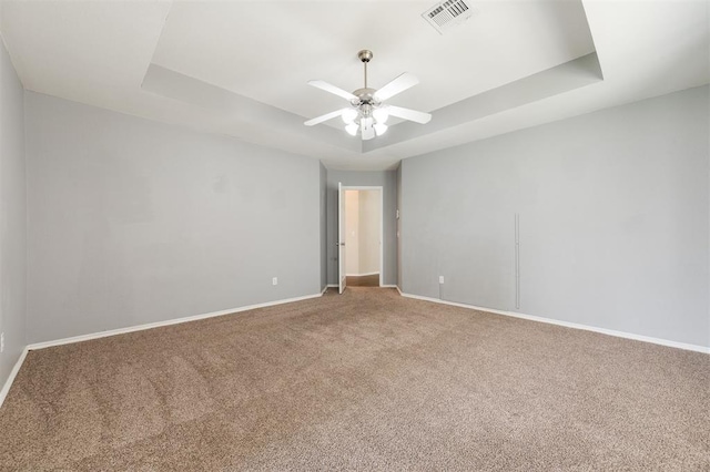 5309 SE 78th St, Oklahoma City, OK 73135 - carpeted empty room featuring a raised ceiling, baseboards, and a ceiling fan