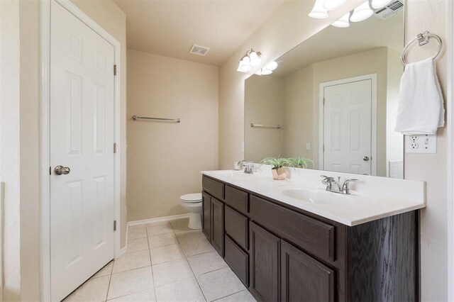 5309 SE 78th St, Oklahoma City, OK 73135 - bathroom with tile patterned flooring, double vanity, baseboards, and toilet