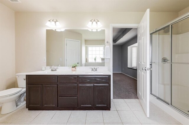 5309 SE 78th St, Oklahoma City, OK 73135 - full bath featuring a stall shower, tile patterned floors, double vanity, toilet, and baseboards