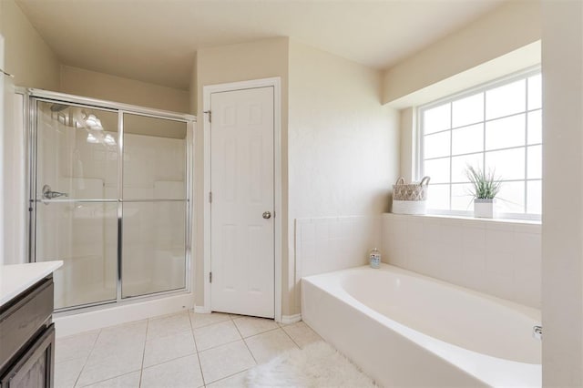 5309 SE 78th St, Oklahoma City, OK 73135 - bathroom with tile patterned floors, a stall shower, a garden tub, and vanity