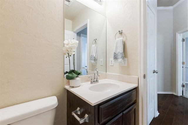 5309 SE 78th St, Oklahoma City, OK 73135 - bathroom featuring toilet, vanity, wood finished floors, and crown molding