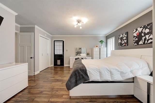 7712 Rumsey Rd, Oklahoma City, OK 73132 - bedroom featuring dark wood-style floors, baseboards, and crown molding