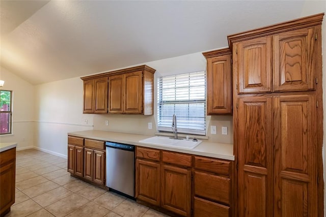 1417 Mayer Dr, Yukon, OK 73099 - kitchen with dishwasher, brown cabinets, light countertops, lofted ceiling, and light tile patterned flooring