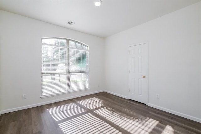 1417 Mayer Dr, Yukon, OK 73099 - empty room with wood finished floors and baseboards